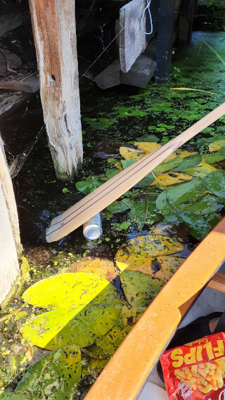 Fishing cans out of the river. Photo: ©Seas & Straws