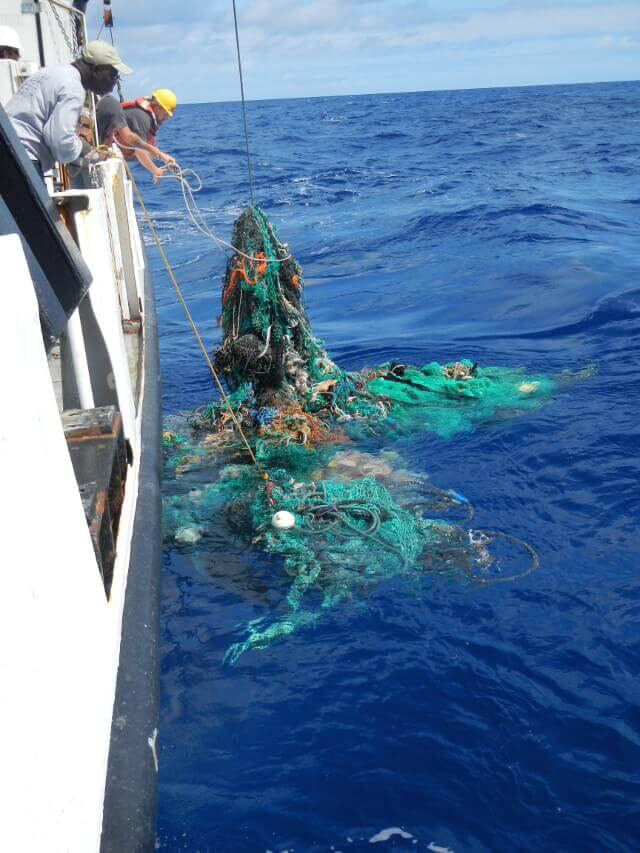 The Ocean Cleanup retrieves a discarded ghost net.