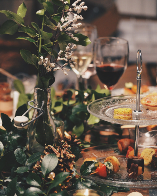 Decorate your table with pine twigs and cones and serve finger food.