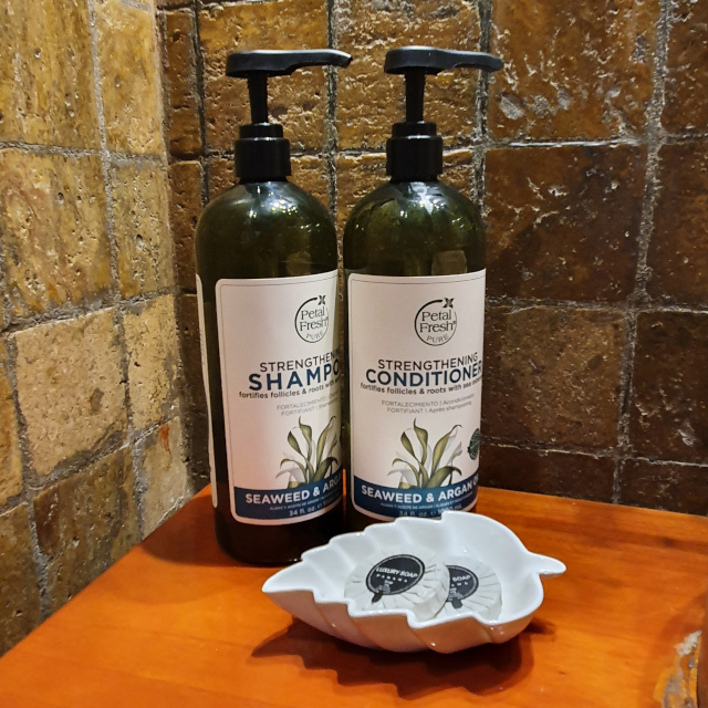 Refillable shampoo bottles and bar soap at the Royal Palm in Panama. Photo: ©seasandstraws