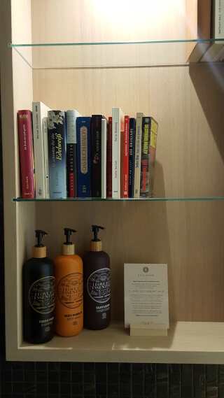 Books and organic toiletries in the bathroom. Photo: Seas & Straws