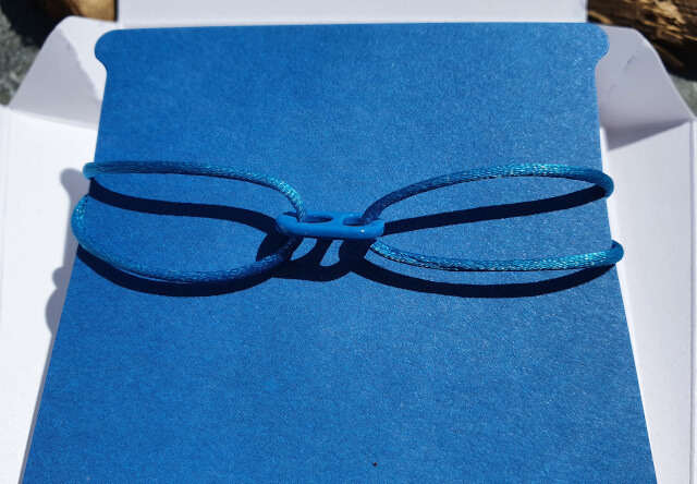 My Goal 14 Band is a vibrant blue color that looks beautiful on tanned skin. Photo: Seas & Straws